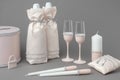 Wedding accessories: bottles of champagne in bags, wine glasses, candles, box for money, wedding lock and pillow for rings Royalty Free Stock Photo