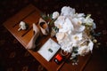 Wedding accessories: bridal bouquet, two buttonholes, women`s shoes, wedding rings in a box, women`s bracelet, envelope with a Royalty Free Stock Photo