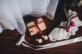 Wedding Accessories. Dress earrings box garter lying on a brown table Royalty Free Stock Photo