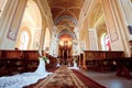 Wedding accessories and interior in Saint Trinity Orthodox Convent including two candlesticks with many candles, flowers, icons Royalty Free Stock Photo