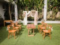 wedding altar and row of brown and white chairs shot at low angle prepared on the beautiful park or garden Royalty Free Stock Photo