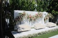 wedding altar and row of brown and white chairs shot at low angle prepared on the beautiful park or garden Royalty Free Stock Photo