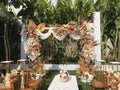 wedding altar and row of brown and white chairs shot at low angle prepared on the beautiful park or garden Royalty Free Stock Photo