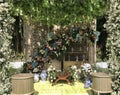 wedding altar and row of brown and white chairs shot at low angle prepared on the beautiful park or garden Royalty Free Stock Photo