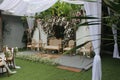 wedding altar and row of brown chairs shot at eye level angle prepared on the beautiful park or garden Royalty Free Stock Photo