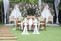 wedding altar and row of brown and white chairs shot at low angle prepared on the beautiful park or garden Royalty Free Stock Photo