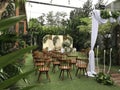 wedding altar and row of brown and white chairs shot at low angle prepared on the beautiful park or garden Royalty Free Stock Photo