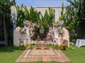 wedding altar and row of brown chairs shot at eye level angle prepared on the beautiful park or garden with flowers decoration Royalty Free Stock Photo
