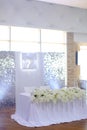 Wedding amazing banquet table decorated by flowers.