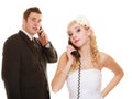 Wedding. Angry bride and groom talking on phone Royalty Free Stock Photo