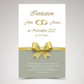 Wedding announcement with gold ribbon and rings