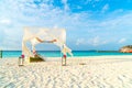 wedding arch on beach with tropical Maldives resort and sea Royalty Free Stock Photo