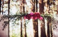 Wedding arch decorated with bright flowers