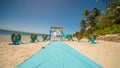 A wedding arch decorated with flowers and large wind-developing fabrics on a tropical beach. Philippines. Bohol. Royalty Free Stock Photo