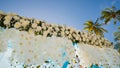 A wedding arch decorated with flowers and large wind-developing fabrics on a tropical beach. Philippines. Bohol. Royalty Free Stock Photo