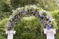 Wedding arch decorated with flowers. Royalty Free Stock Photo