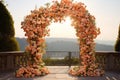 Wedding arch decorated with flowers at sunset. Wedding decor with pink and orange colors Royalty Free Stock Photo