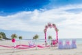 Wedding arch decorated with flowers on tropical beach, outd