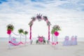 Wedding arch decorated with flowers on tropical beach, outd Royalty Free Stock Photo