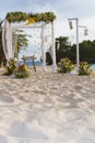 wedding arch - tent - decorated with flowers on beach, tropical wedding ceremony set up Royalty Free Stock Photo