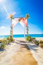 Wedding arch decorated with flowers on tropical sand beach, outd Royalty Free Stock Photo