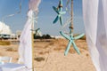 Wedding arch decorated with star fish and straw,on a sand beach for wedding ceremony Royalty Free Stock Photo