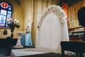 Wedding arch and decoration in interior of Catholic church Royalty Free Stock Photo