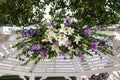 wedding arch flowers with lavender purple flowers white lilies floral bouquet marriage weddings event ceremony Royalty Free Stock Photo