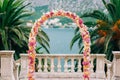 Wedding Arch of hydrangeas and roses. Wedding ceremony in the Ba