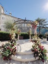 Wedding arch rotunda decorated with flowers stands in the garden Royalty Free Stock Photo