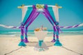 Wedding archway are arranged on the sand in preparation for a beach wedding ceremony. Royalty Free Stock Photo