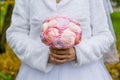 Wedding artificial bouquet in the bride hands