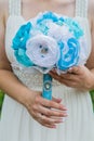 Wedding artificial bouquet in the bride hands