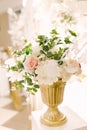 Wedding artificial flowers in a gold flowerpot