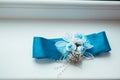 Wedding background with blue bridal garter on the Royalty Free Stock Photo