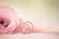 Wedding Background with gold Rings and beautiful Eustoma rose f