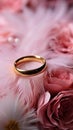 Wedding Background with gold Rings, Eustoma rose flower and light pink feather Royalty Free Stock Photo