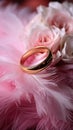 Wedding Background with gold Rings, Eustoma rose flower and light pink feather Royalty Free Stock Photo