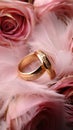 Wedding Background with gold Rings, Eustoma rose flower and light pink feather Royalty Free Stock Photo