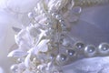 Wedding background with lace, pearls and ribbons. Royalty Free Stock Photo