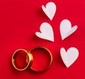 Wedding background - two gold wedding rings and handmade hearts Royalty Free Stock Photo