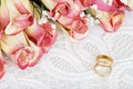 Wedding bands with bunch of roses Royalty Free Stock Photo
