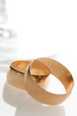 Wedding bands and glass Royalty Free Stock Photo