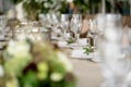 Wedding Banquet or gala dinner. The chairs and table for guests, served with cutlery and crockery. Covered with a linen Royalty Free Stock Photo