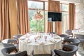 Wedding Banquet or gala dinner. The chairs and table for guests, served with cutlery and crockery. Covered with a pastel Royalty Free Stock Photo