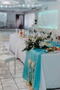 Wedding Banquet hall decorated with flowers. Table setting at a luxury wedding reception. Served for banquet tables in a Royalty Free Stock Photo