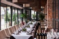 Wedding banquet table decorated with greenery and serve