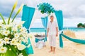 Wedding on the beach. The groom waits for the bride under the ar Royalty Free Stock Photo