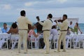 Traditional wedding party on the beach in Mexico with Mariachi music