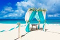 Wedding on the beach . Wedding arch decorated with flowers on tr